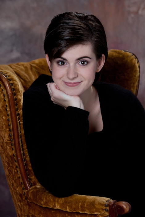 Professional portrait of girl in armchair